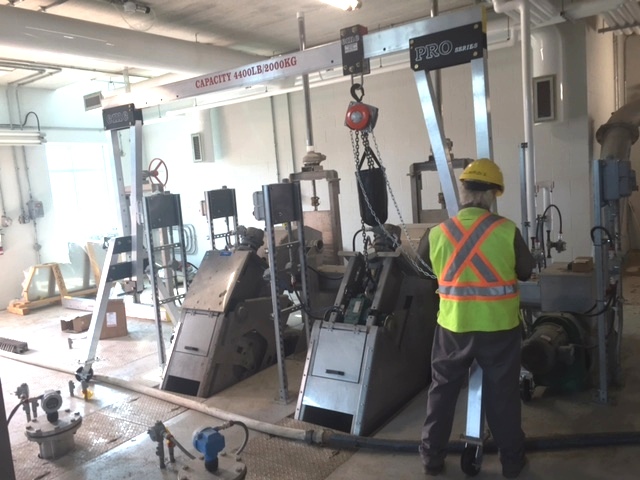 eme aluminum gantry positioned over a wastewater plant headworks for a maintenance lift