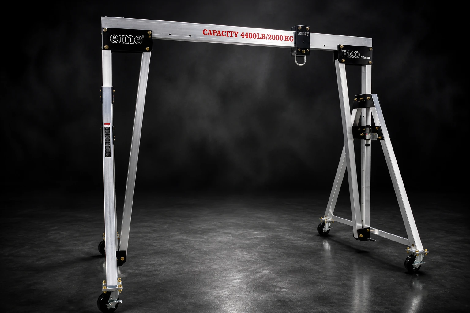 eme aluminum A-frame gantry crane, 4,400 lb capacity, studio shot on dark seamless