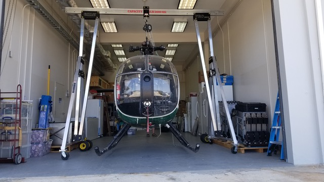 Helicopter being lifted by an eme aluminum gantry crane